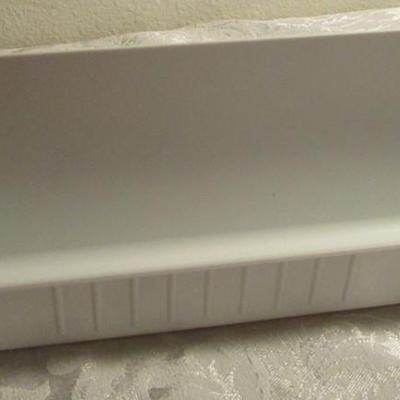 Rev-A- Shelf molded sink tip-out trays with hinges