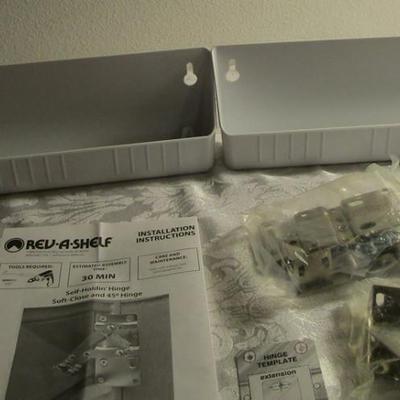 Rev-A- Shelf molded sink tip-out trays with hinges