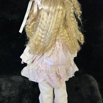 Vintage porcelain doll and stand