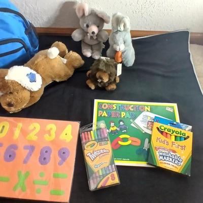 Foam number puzzle, Twistable Crayola's, stuffed animals and a small child sized backpack