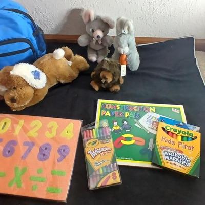 Foam number puzzle, Twistable Crayola's, stuffed animals and a small child sized backpack