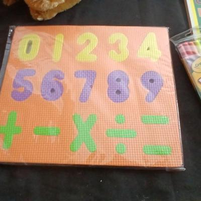 Foam number puzzle, Twistable Crayola's, stuffed animals and a small child sized backpack