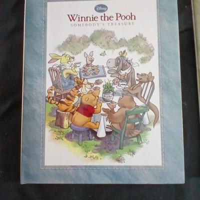 Four Winnie the Pooh books and a TY teddy bear