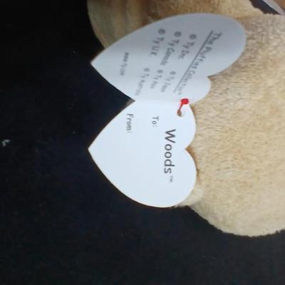 Four Winnie the Pooh books and a TY teddy bear