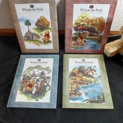 Four Winnie the Pooh books and a TY teddy bear