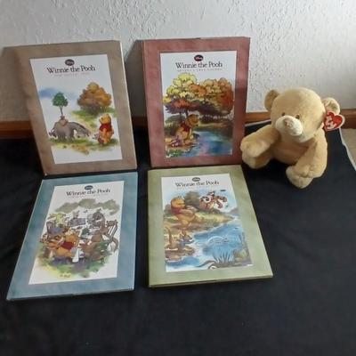 Four Winnie the Pooh books and a TY teddy bear