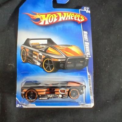 Tonka trucks - and two hot wheels cars in packaging