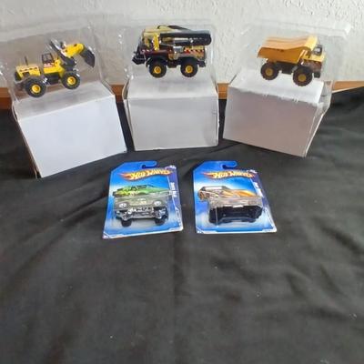 Tonka trucks - and two hot wheels cars in packaging