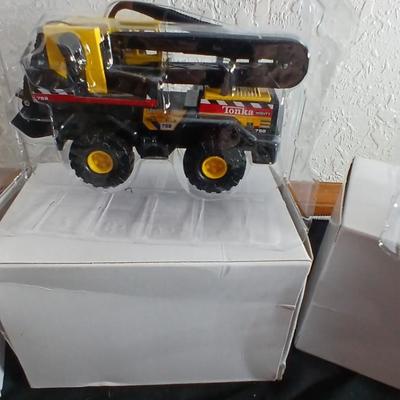 Tonka trucks - and two hot wheels cars in packaging