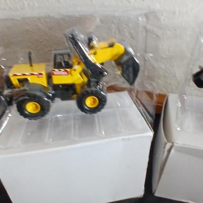 Tonka trucks - and two hot wheels cars in packaging