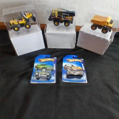 Tonka trucks - and two hot wheels cars in packaging