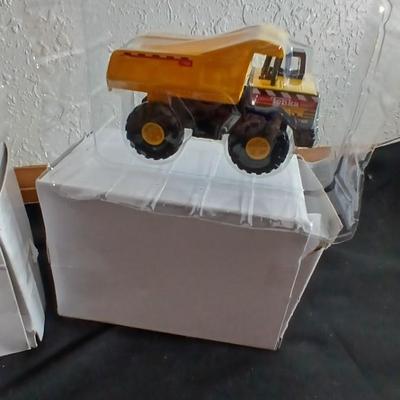 Tonka trucks - and two hot wheels cars in packaging