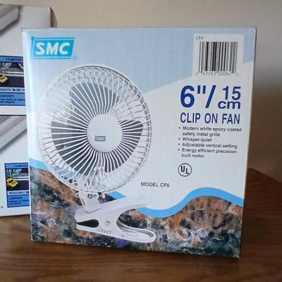 Two brand new Deflect-o Air Deflectors for vents and a 6" clip on fan