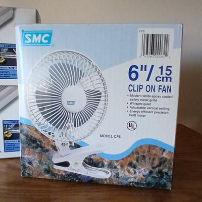 Two brand new Deflect-o Air Deflectors for vents and a 6" clip on fan