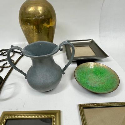 Sale Photo Thumbnail #388: Wrought iron photo Frame stand, brass urn, 3 small photo frames, ceramic dish, and pewter relief handled jug wall decor.  All in good condition.