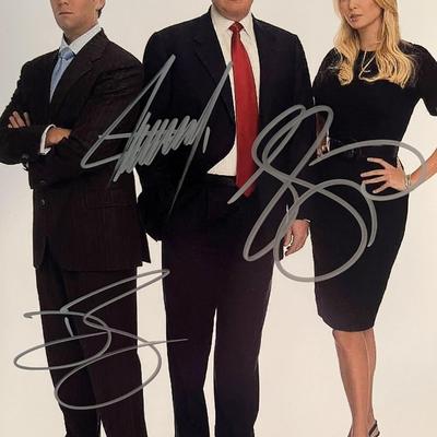 Donald Trump, Donald Trump Jr. and Ivanka Trump signed photo.