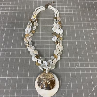 Sand Dollar Pendant and Mother of Peal. 