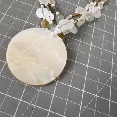 Sand Dollar Pendant and Mother of Peal. 