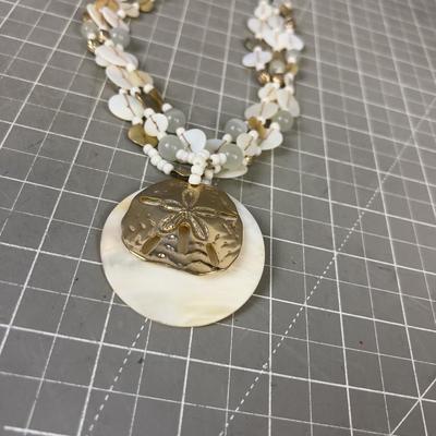 Sand Dollar Pendant and Mother of Peal. 
