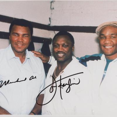 Muhammad Ali and Joe Frazier signed photo. GFA Authenticated