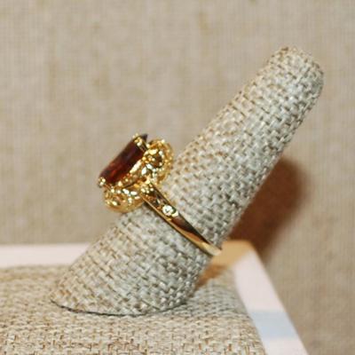 Size 8½ Large Mocha Brown Oval Center Stone Ring on a Nest Setting and Gold Tone Band (4.0g)
