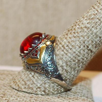 Size 10 Large Oval Red Stone Ring with "School Class Ring" Style Accents on a Silver Tone Band (6.3g)