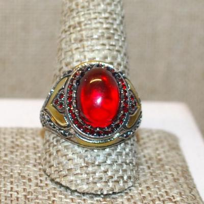 Size 10 Large Oval Red Stone Ring with "School Class Ring" Style Accents on a Silver Tone Band (6.3g)