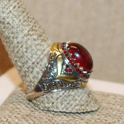 Size 10 Large Oval Red Stone Ring with "School Class Ring" Style Accents on a Silver Tone Band (6.3g)