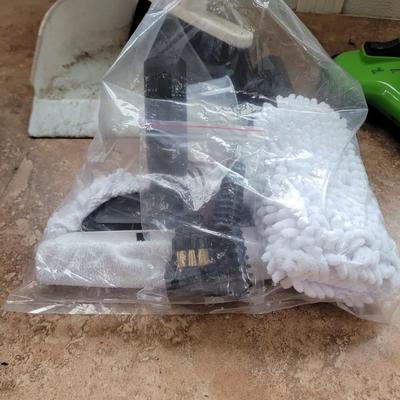 Steam cleaner, pads, booklet and small Broomfield and duatbin
