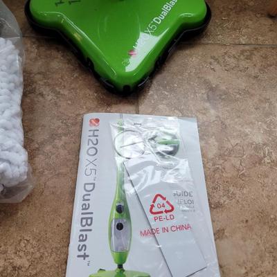 Steam cleaner, pads, booklet and small Broomfield and duatbin