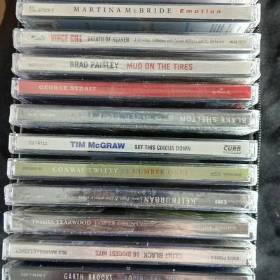 Fifteen CD's some are brand new and sealed. Come with a cd case