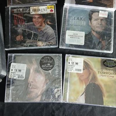 Fifteen CD's some are brand new and sealed. Come with a cd case