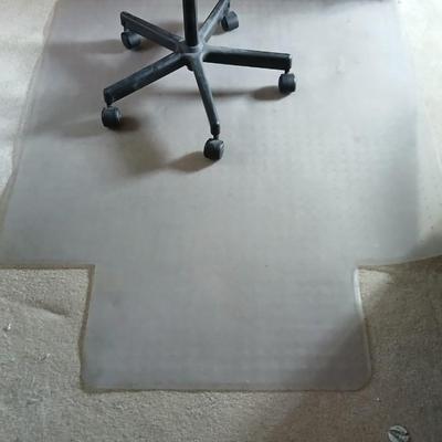 HON Adjustable office chair with a hard desk mat
