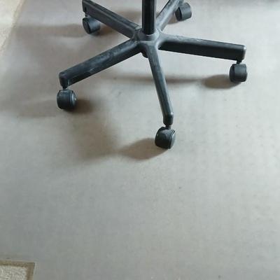 HON Adjustable office chair with a hard desk mat