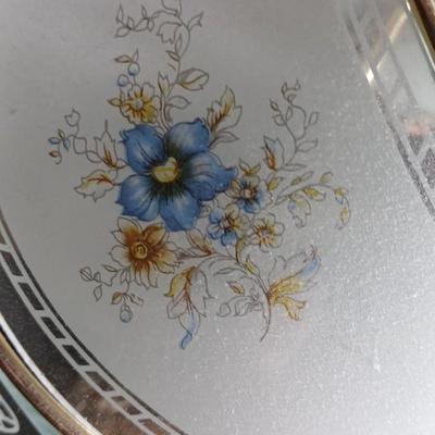 Small touch lamp with framed pictures of Flowers