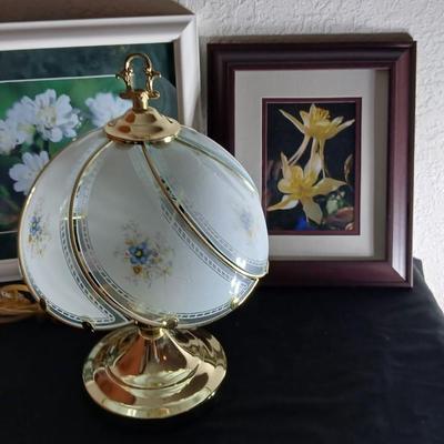 Small touch lamp with framed pictures of Flowers