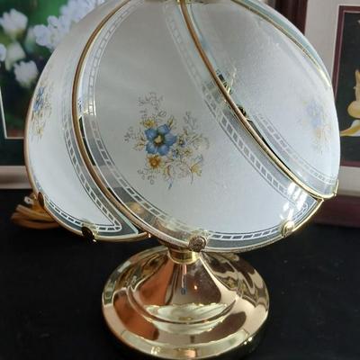 Small touch lamp with framed pictures of Flowers