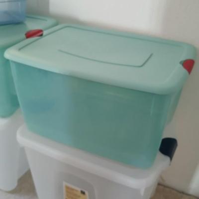 Five totes 4 large sized and one smaller tote with lids