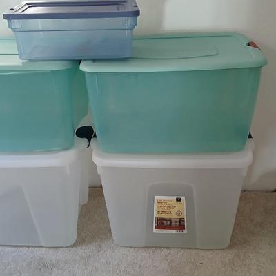 Five totes 4 large sized and one smaller tote with lids