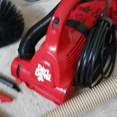 Small handheld Royal Dust Devil vacuum and attachments with ceiling fan brush