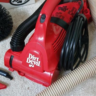 Small handheld Royal Dust Devil vacuum and attachments with ceiling fan brush