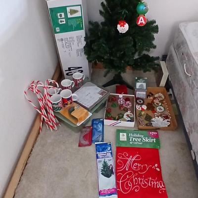 Faux Christmas tree with all the embellishments Ornaments, large candy canes, new tree topper and more