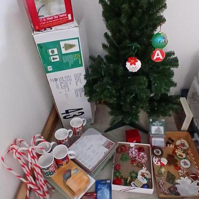 Faux Christmas tree with all the embellishments Ornaments, large candy canes, new tree topper and more