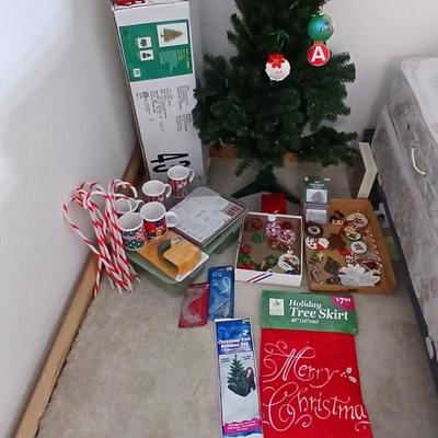 Faux Christmas tree with all the embellishments Ornaments, large candy canes, new tree topper and more