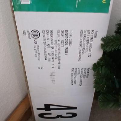 Faux Christmas tree with all the embellishments Ornaments, large candy canes, new tree topper and more
