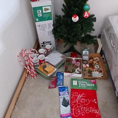 Faux Christmas tree with all the embellishments Ornaments, large candy canes, new tree topper and more