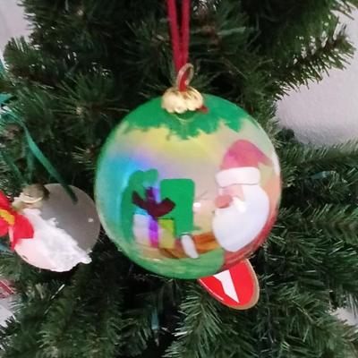 Faux Christmas tree with all the embellishments Ornaments, large candy canes, new tree topper and more