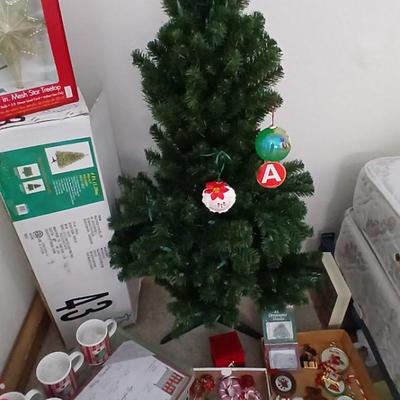 Faux Christmas tree with all the embellishments Ornaments, large candy canes, new tree topper and more