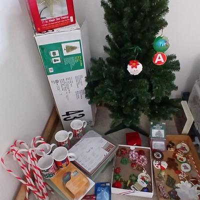 Faux Christmas tree with all the embellishments Ornaments, large candy canes, new tree topper and more