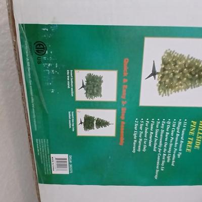 Faux Christmas tree with all the embellishments Ornaments, large candy canes, new tree topper and more